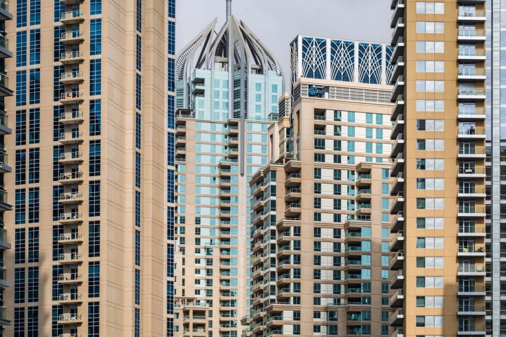 Modern skyscrapers with distinctive architectural designs in an urban cityscape.